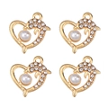 Macro detail of four gold heart pendants with crystal dolphins and pearls on white backdrop - Dolphin Heart Pearl (px1086-19)
