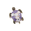 Detailed close-up of a vintage purple and white enamel sea turtle brooch with gold tone. - Violet
