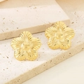 Detailed close-up of textured 18K gold-plated stainless steel flower-shaped earrings - Polished Gold Flower (KE114635-KFC)