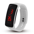 Close-up of white LED digital watch with black rectangular screen and red time display - White