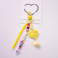 Detail of yellow pixel heart charm with beaded chain and I LOVE U alphabet beads - Yellow