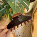 Y2K dopamine style dark brown tortoiseshell resin hair claw clip held in hand - Caramel Brown