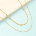 Double-layered gold snake bone blade chain necklaces displayed on stone background - Blade Chain 40cm + Round Snake Chain 45cm / Gold