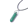 Detail of hexagonal malachite crystal pendant with green stripes and black wax cord - Malachite