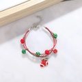 Detailed view of Christmas charm bracelet with red green beads and silver bells - Style J Red Xmas Sock
