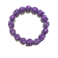 Purple synthetic turquoise skull beaded bracelet with gothic punk style on white background - Purple