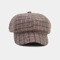 Close-up detail of a vintage British style plaid newsboy cap featuring wool blend fabric - Khaki
