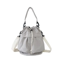 Minimalist grey nylon drawstring bucket bag with a wide off-white fabric shoulder strap - One Size / Light Gray