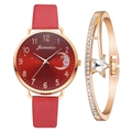 Detail view of red starry sky dial watch and matching gold rhinestone moon bracelet set - Watch and Bracelet Set / Red