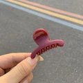 Elegant large burgundy hair claw clip with glossy finish held by a hand on outdoors - Wine Red - Round Head Small Hanger Claw