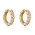 Golden flower hoop earrings with white and pink enamel petals on a reflective background - White And Light Orange Enamel Clover