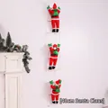 Detailed view of three 40cm Santa Claus figures climbing a white rope ladder decoration - 40cm 3 People Ladder