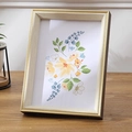 Nordic light wood photo frame with golden inner rim and floral art on a wooden desk - 8 inch (15*20cm) / Moonlight Gold
