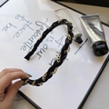 Braided black leather and gold metal chain headband shown in a handheld lifestyle view - 201025 Black