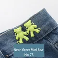 Neon green mini bear waist buckle no. 73 on blue denim jeans for adjustable sizing - Hand-sewn Bear / Fluorescent Green