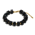 Minimalistisches Armband aus schwarzen Acryl-Zylindern mit goldenen Perlen und Edelstahl - Armband / Gold Schwarz Marmor