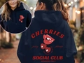 Navy blue Cherry Social Club hoodie featuring red cherry graphics and high quality cotton fabric - S / Navy Slogan