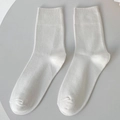Minimalist solid white cotton blend crew socks with fine ribbed cuffs on a round base - One Size / White
