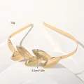Detail showing 3.2cm golden metal leaves with textured finish on a bridal headband - Metal Headband-6 Twill Leaves