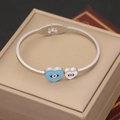 Polished stainless steel evil eye heart bangle displayed on a beige jewelry gift box - Double Heart Evil Eye Style (4#)