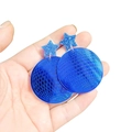 Close-up of blue mirror acrylic disco ball earrings with glitter star details held in hand - Royal Blue