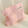 Pink jacquard canvas makeup bag with rose pattern and woven label branding - Pink