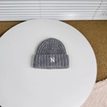 Macro detail of dark grey rib-knit beanie with white embroidered letter N on cuff - Approx. 3-8 Years / Gray