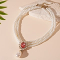 Detail of vintage Baroque triple-layer pearl necklace with red crystal floral pendant - Flower Water Drop Pearl Necklace
