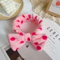 Pink polka dot bow headband in soft coral fleece for skincare and makeup routines - Pink Rose Red Dots