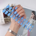 Set of 24 long square light blue glossy press-on nails displayed on a plastic frame - Light Blue (CFL-06)