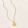 Detailed view of a gold heart pendant featuring a unique honeycomb textured pattern - Gold Honeycomb Heart