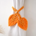 Close-up of orange leaf-shaped cotton rope curtain tieback with wooden bead detail - Leaf Shape Style / Gold Yellow