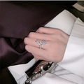 Elegant adjustable silver star ring with shimmering zircons worn by a female model - Luxury Star Ring