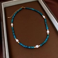 Detail of beaded necklace with blue faceted beads, pearls and gold lobster clasp - 31# Necklace-Blue-Gold-White-Gift Box