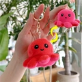 Close-up of reversible octopus plush keychain with mood-changing faces and gold clasp - Red to Rosy Red - Gold Hook