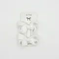 Detail view of two white grosgrain ribbon bows on a fashion display card - 2 Pcs/Set / White