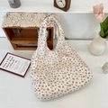 Detail of floral pleated canvas tote bag with textured fabric and vintage brand label - Floral Tote Vest Bag