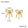 Detail of bow-shaped stud earrings with hanging white teardrop pearls in gold finish - Gold Bowknot Pearl