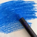 Single professional blue oil pastel crayon for artists showing vibrant color strokes - Ultramarine