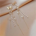 Detail of elegant bow earrings with pearls and long crystal fringe on gold silk - Gold Tassel Earrings (Silver Needle)