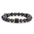 Lava stone bead bracelet featuring grey marble beads and golden spacers on white background - Dark Grey Stone With Gold Spacers