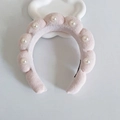 Pink velvet padded headband with artificial pearls on a white cloud prop - Lotus Color With Pearls