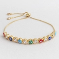Detail of adjustable gold bolo bracelet featuring colorful enamel evil eye charms and zircons - Deep Mixed Colors