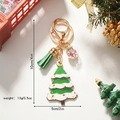 Portachiavi natalizio in legno con nappa verde e sfera di stelle su sfondo festivo - Portachiavi di Natale