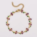 Dettaglio del bracciale a ciliegia dorato con gemme viola e foglie in smalto verde - Viola