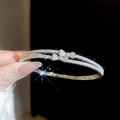 Detailed side view of silver-plated double-layer bracelet with bow and pavé zircons - Silver (Double Layer Bow)