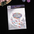 Colorful mix of heart and teardrop acrylic face gems in Halloween themed packaging - Colorful Heart