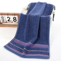 Dark blue cotton towel featuring decorative colorful stripes in a woven basket - Weak Twist Herringbone Blue / 34*74cm