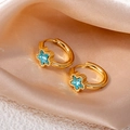 Golden star hoop earrings featuring a brilliant blue zircon star center on luxury satin - Star Zircon / Blue