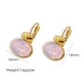 Detail view of oval gold hoop earrings with faceted pink stone and leverback closure - Pink